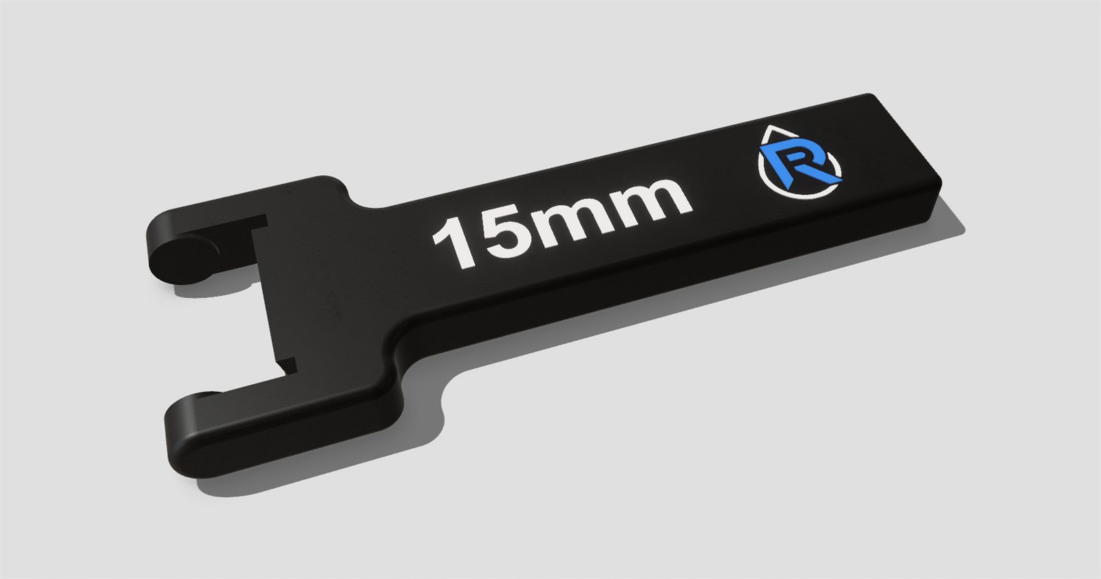 CAD render of a black 15mm spanner-style handle with a logo